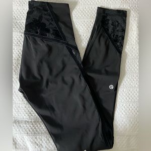Lululemon black leggings with velvet piping and floral details